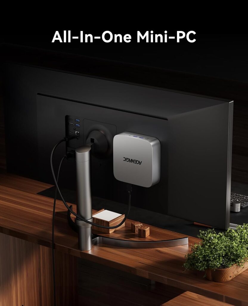 The ACEMAGIC M1 Mini PC mounted behind a monitor with a VESA Mount.