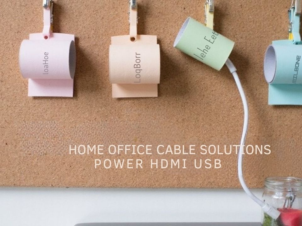 A realistic image of a DIY cable organizer made from toilet paper rolls, binder clips, and clothespins arranged neatly on a home office desk. This is one of our great cable storage ideas for home office. The rolls are labeled, painted in pastel colors, and mounted vertically on a corkboard. Cables are routed through the organizers, creating a clean workspace. 